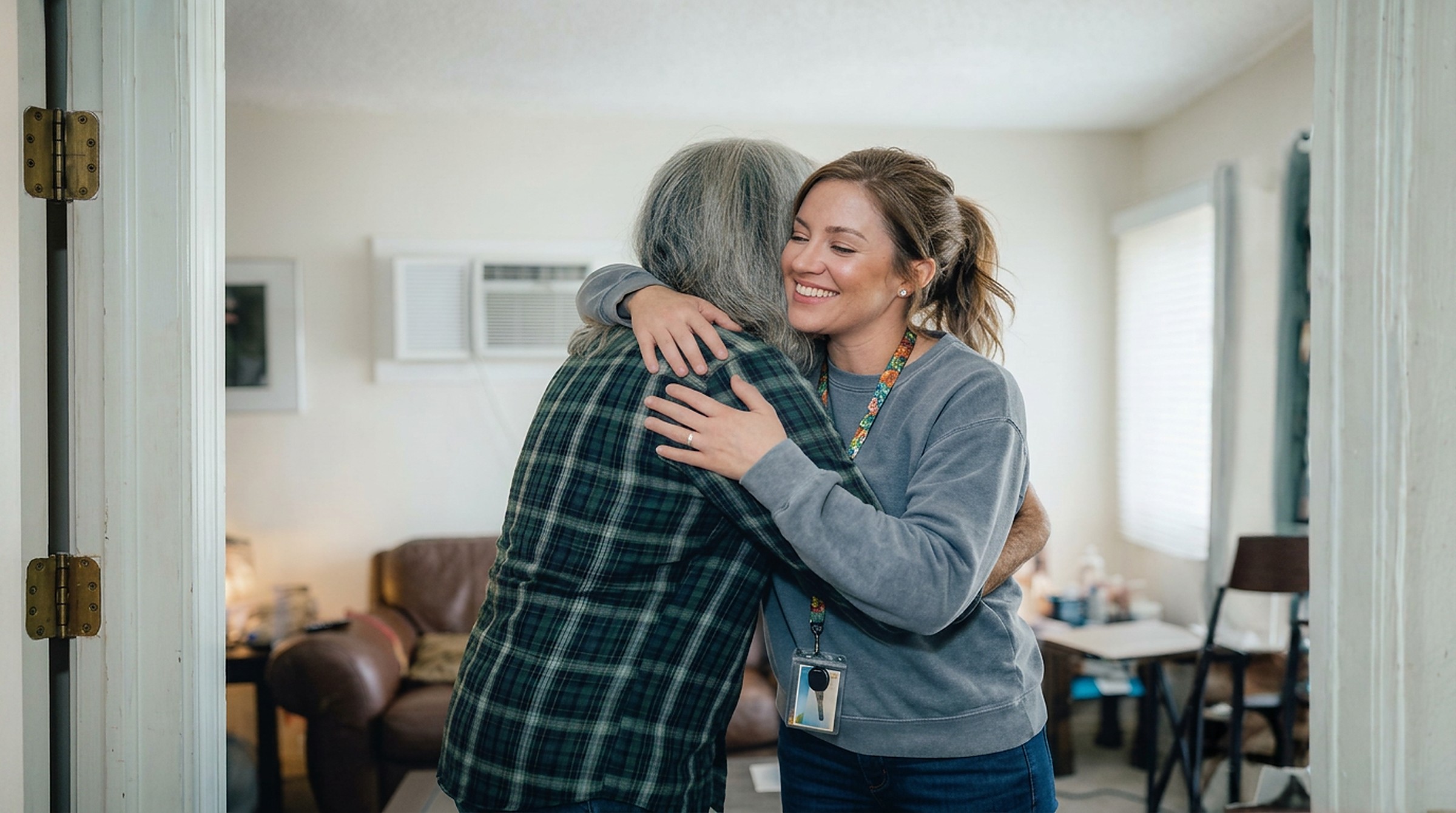 Two people embracing — the human moment at the heart of our work